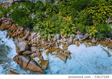 Aerial drone photo of stony boulders of beautiful Anse Cocos beach at La Digue, Seychelles Aerial drone photo of stony boulders of beautiful Anse Cocos beach at La Digue, Seychelles 53617260