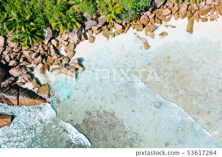 Aerial drone bird eye shot of beautiful paradise tropical Anse Cocos beach at La Digue, Seychelles 53617264