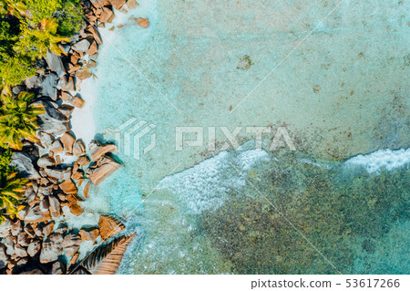 Aerial drone bird eye shot of beautiful paradise like tropical beach at Seychelles Aerial drone bird eye shot of beautiful paradise like tropical beach at Seychelles 53617266