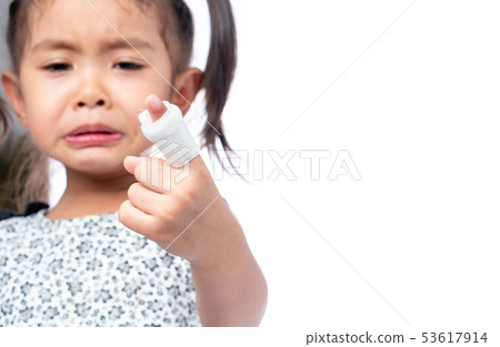 Asian girl treat wounds on the fingers by wrapping Asian girl treat wounds on the fingers by wrapping 53617914