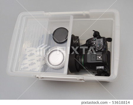 Camera and lens in a dry box 53618814