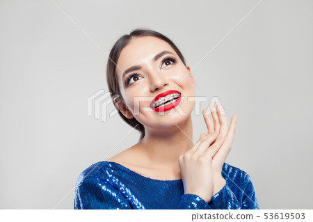 Portrait of pretty girl with braces on teeth. Portrait of pretty girl with braces on teeth. 53619503