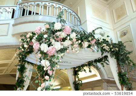 Wedding chuppah decorated with fresh flowers 53619854
