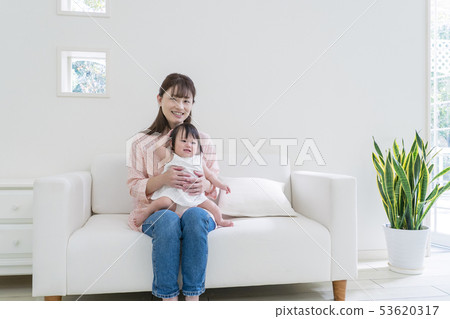 Parents sitting on the sofa 53620317