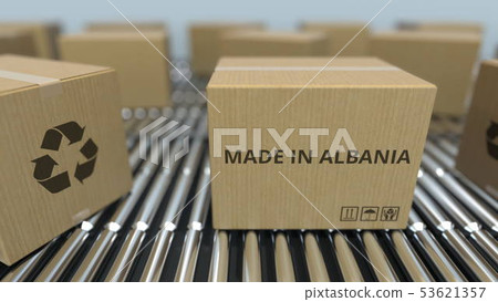 Boxes with MADE IN ALBANIA text on roller conveyor. Albanian goods related 3D rendering 53621357