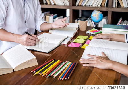 Tutor books with friends, Young students campus or 53621816