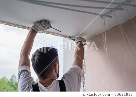 Process male worker repairing window in a house Process male worker repairing window in a house 53621952