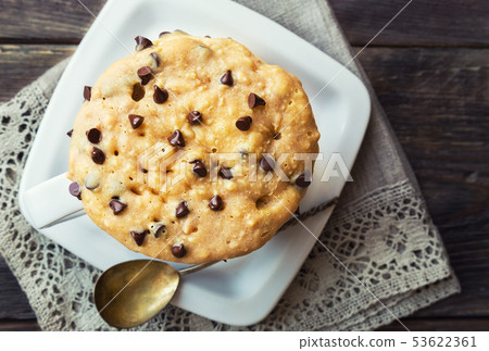 Cake in mug with peanut butter and chocolate chips 53622361