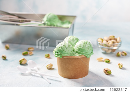 Pistachio ice cream scooped out of container, Pistachio ice cream scooped out of container, 53622847
