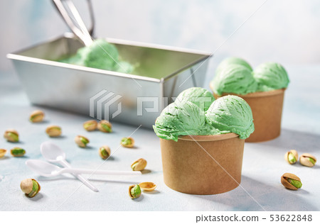 Pistachio ice cream scooped out of container, Pistachio ice cream scooped out of container, 53622848