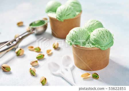 pistachio ice cream in paper cup on mint colors pistachio ice cream in paper cup on mint colors 53622851
