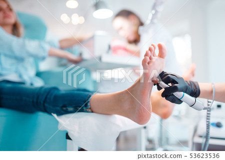 Beautician salon, foot polish procedure Beautician salon, foot polish procedure 53623536