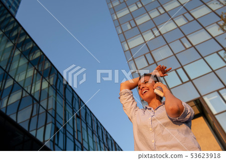 business, communication, technology and people concept - young smiling african american 53623918