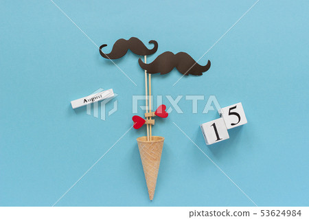 Couple paper mustache props fastened heart in ice 53624984