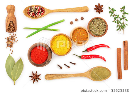 mix of spices in wooden spoon isolated on a white background. Top view. Flat lay. Set or collection 53625388