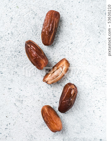 Dried dates on gray cement,copyspace 53630210