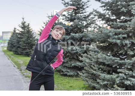 athletic woman leans to the side 53630955