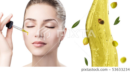 Young beautiful woman near splash of olive oil. Young beautiful woman near splash of olive oil. 53633234