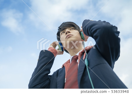 High school student rooftop headphones 53633948