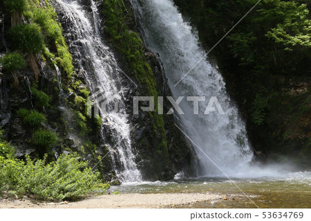 Ginzan Onsen in spring, white silver waterfall Ginzan Onsen in spring, white silver waterfall 53634769