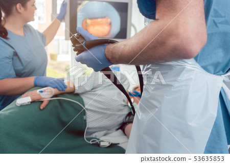 Doctor during endoscopy checking picture of mouth on screen Doctor during endoscopy checking picture of mouth on screen 53635853