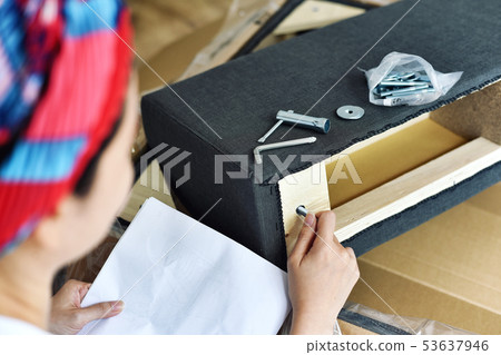 Furniture assembly, Woman looking at the furniture 53637946