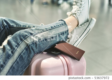 Traveler waiting for flight check-in. Traveler waiting for flight check-in. 53637972