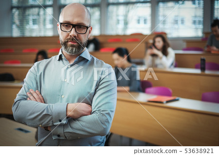 Lecturer and multinational group of students in an auditorium 53638921
