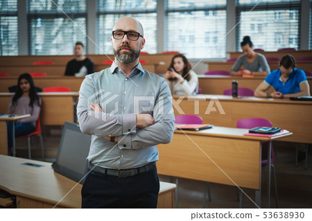 Lecturer and multinational group of students in an auditorium 53638930