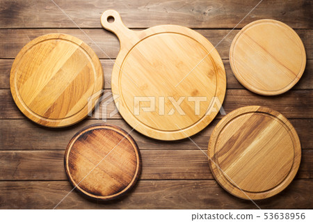 pizza cutting board at wooden plank table pizza cutting board at wooden plank table 53638956