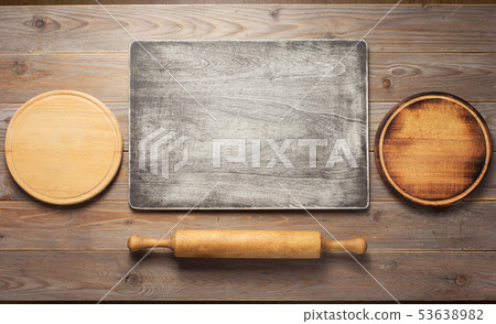 cutting board at wooden plank table 53638982