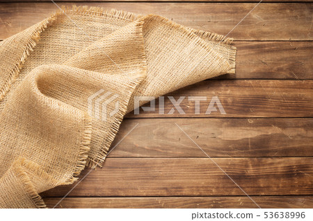 burlap hessian sacking on wooden background 53638996