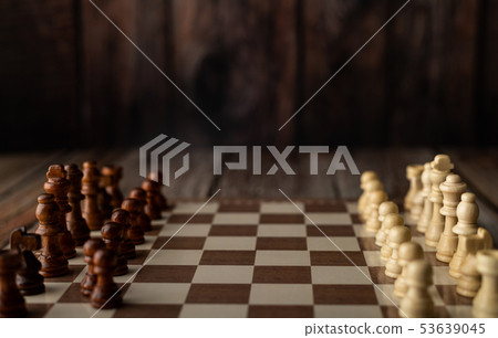 wooden chess endways on the board 53639045