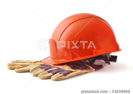 Orange hard hat, safety gloves on white background. Safety helmet. Orange hard hat, safety gloves on white background. Safety helmet. 53639989