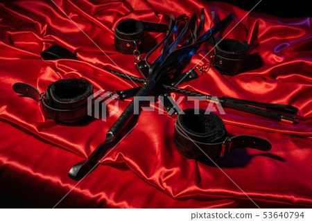 Top view of bdsm outfit. Bondage and whip crossed 53640794