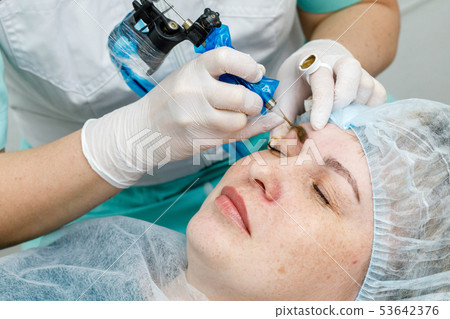 Permanent makeup, tattooing of eyebrows. 53642376
