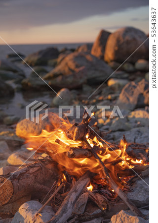 fire burns near the sea 53643637