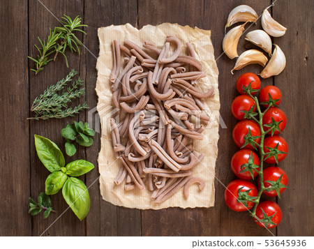 Whole spelt pasta, vegetables,  herbs and olive 53645936