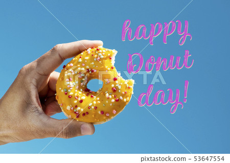nibbled donut and text happy donut day nibbled donut and text happy donut day 53647554