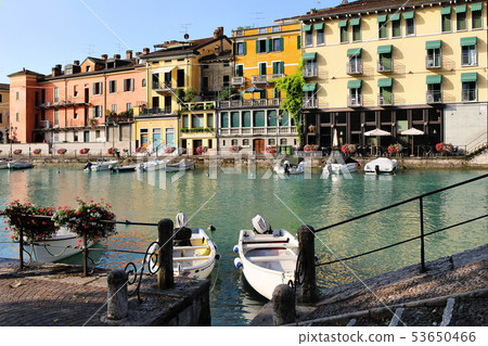 Beautiful morning in Peschiera del Garda town. Colorful houses, architecture view with boats. Little 53650466