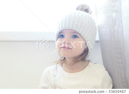 Cute smiling toddler girl looking away isolated on 53650487