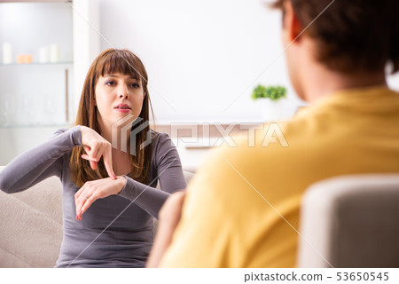 Woman and man learning sign language Woman and man learning sign language 53650545