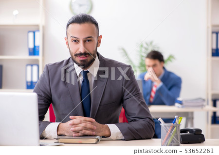 Two male colleagues in the office Two male colleagues in the office 53652261