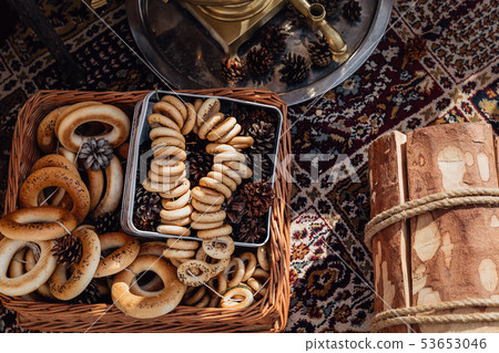 Russian bagels in a basket with fir cones Russian bagels in a basket with fir cones 53653046