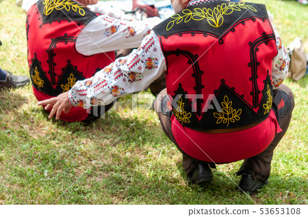 People in traditional costumes dance bulgarian 53653108