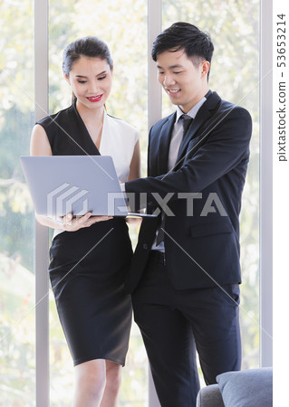 Asian business people standing in office.. 53653214