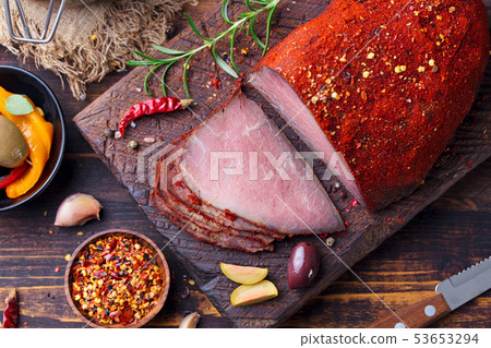 Roasted beef, pastrami on slate cutting board. Top view. 53653294