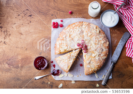 Almond and raspberry cake, Bakewell tart. . Top view. Copy space. Wooden background. Almond and raspberry cake, Bakewell tart. . Top view. Copy space. Wooden background. 53653596