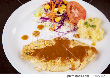chicken steak ready to eating on white dish 53653640