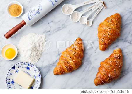 Croissants with baking ingredients. Traditional French pastry. Top view. 53653646